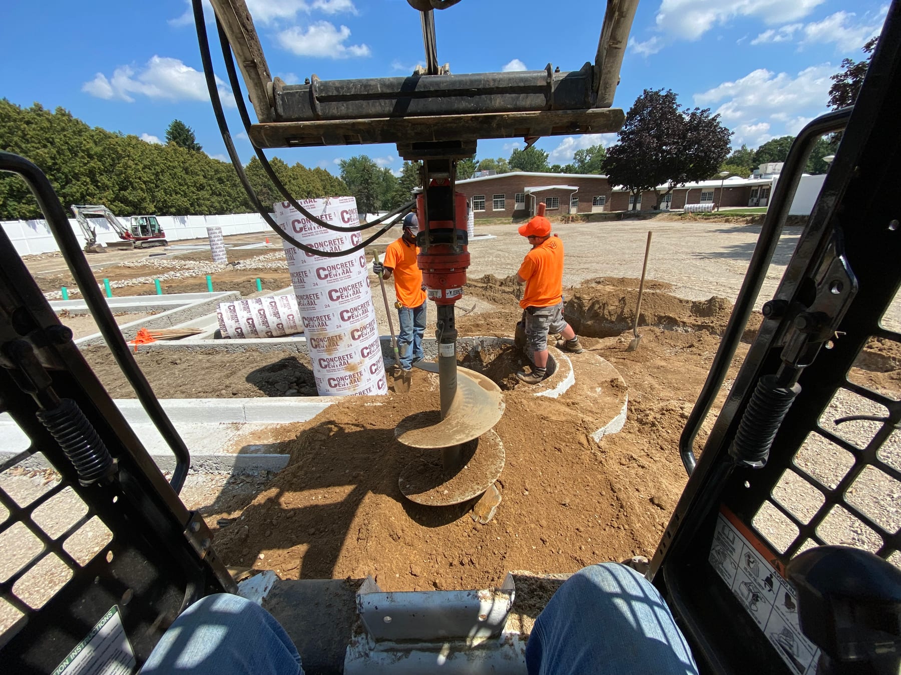 Fine Line crew setting foundations with an auger on a West Michigan site