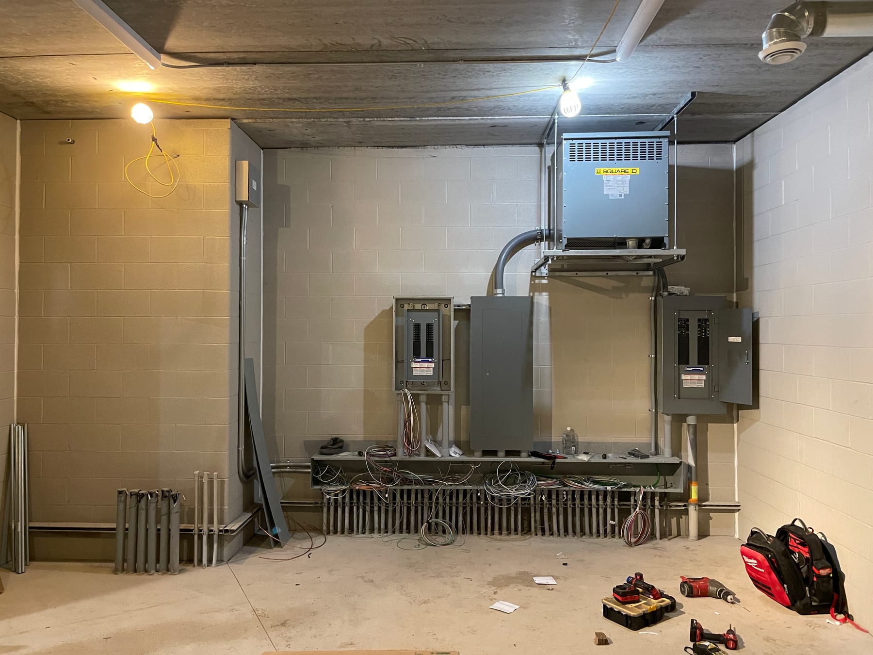 Electrical room at Algoma Christian School — panels and transformer set